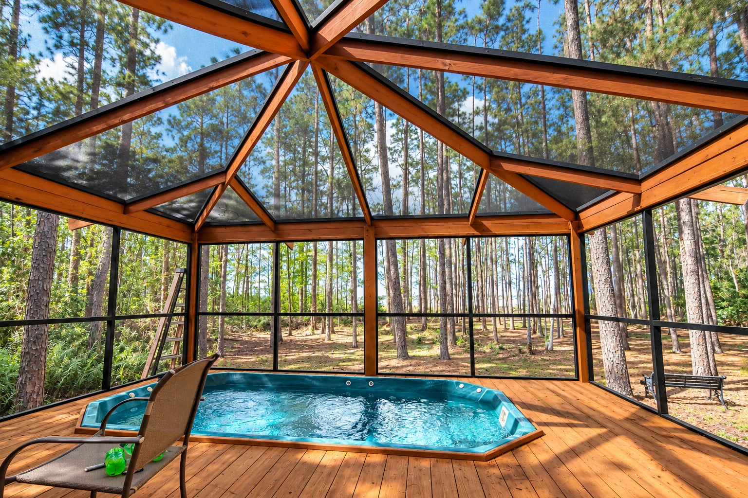 A wood-framed screened patio encloses a small pool, with a peaked transparent roof and forest visible beyond.